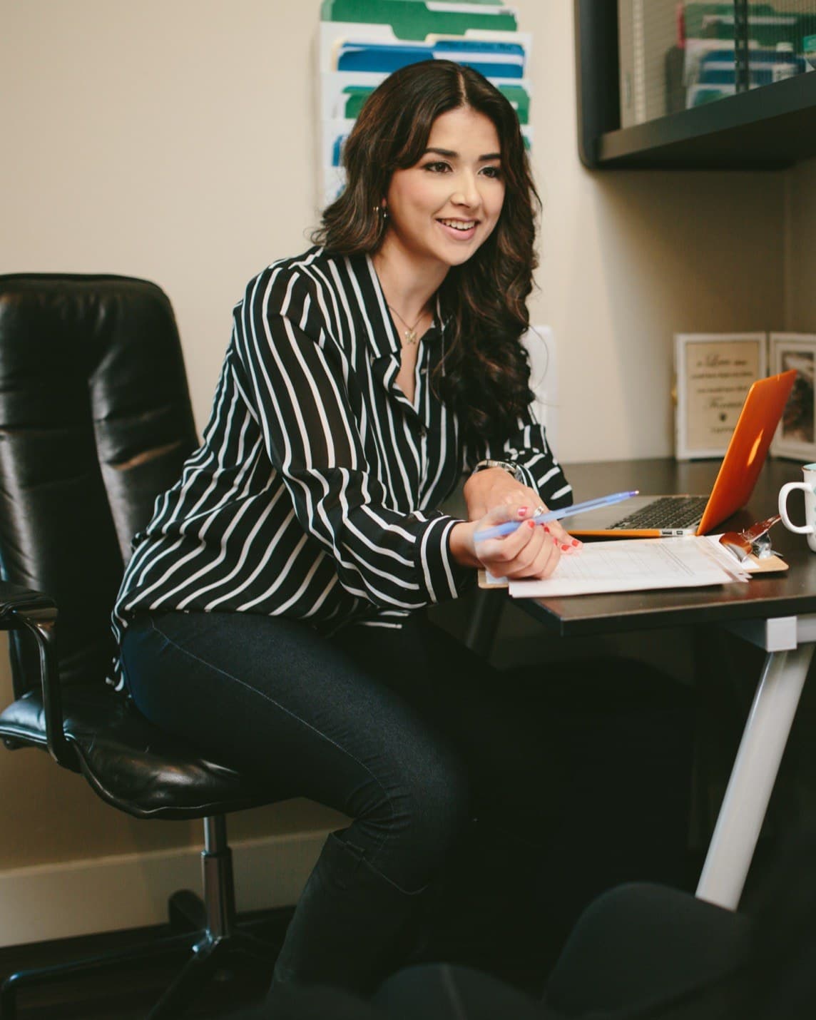 Dr. Teja in conversation with a patient, seated at a desk